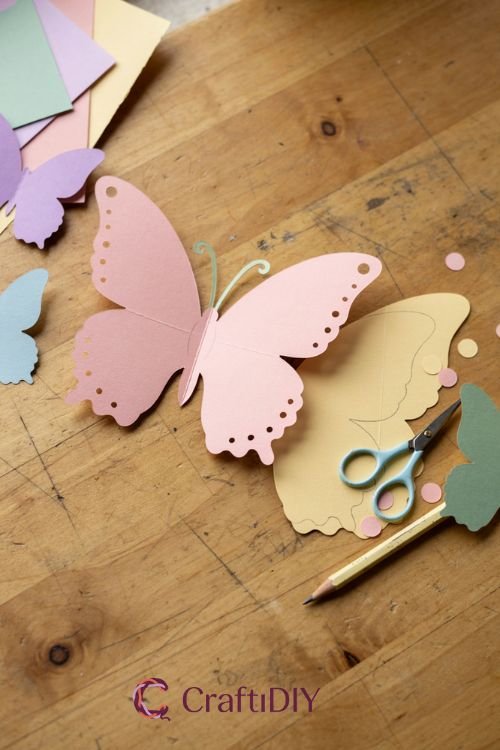Paper butterfly crafts with simple symmetrical cutout butterflies